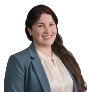 Emily Hawkins A woman with long brown hair, wearing a light blouse and blue blazer, smiles at the camera against a plain white background.
