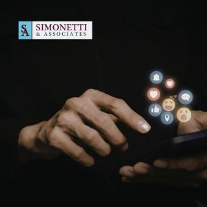 Hands using a smartphone with social media notification icons; Simonetti & Associates, Divorce Lawyer in Lake Grove, logo appears in the top left corner.